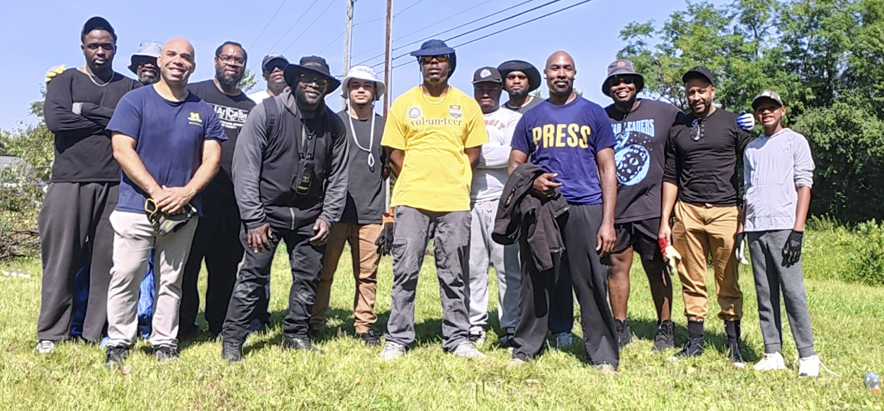 Community volunteers serving together at the Woodlawn Cemetery restoration project