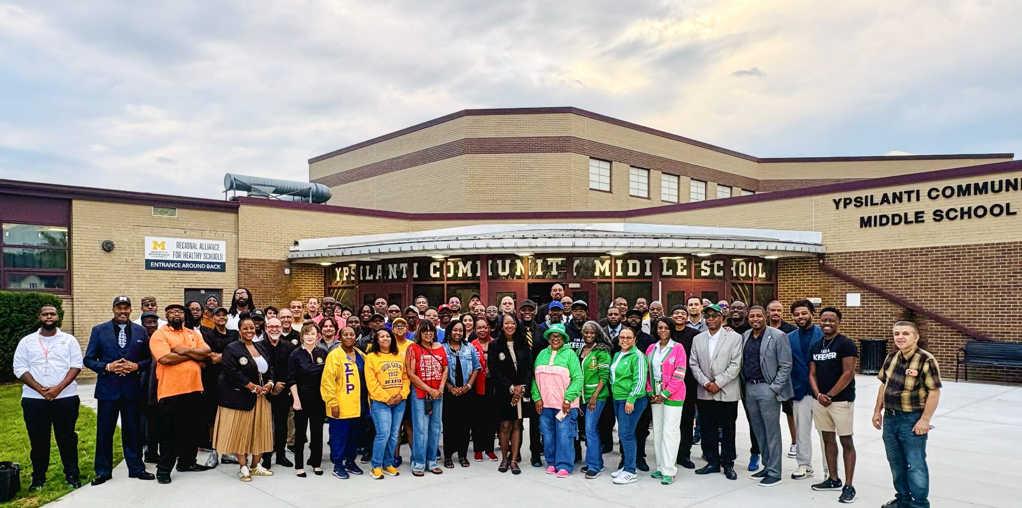 Community partners and volunteers gathered at Ypsilanti Community Middle School for a student clap-in