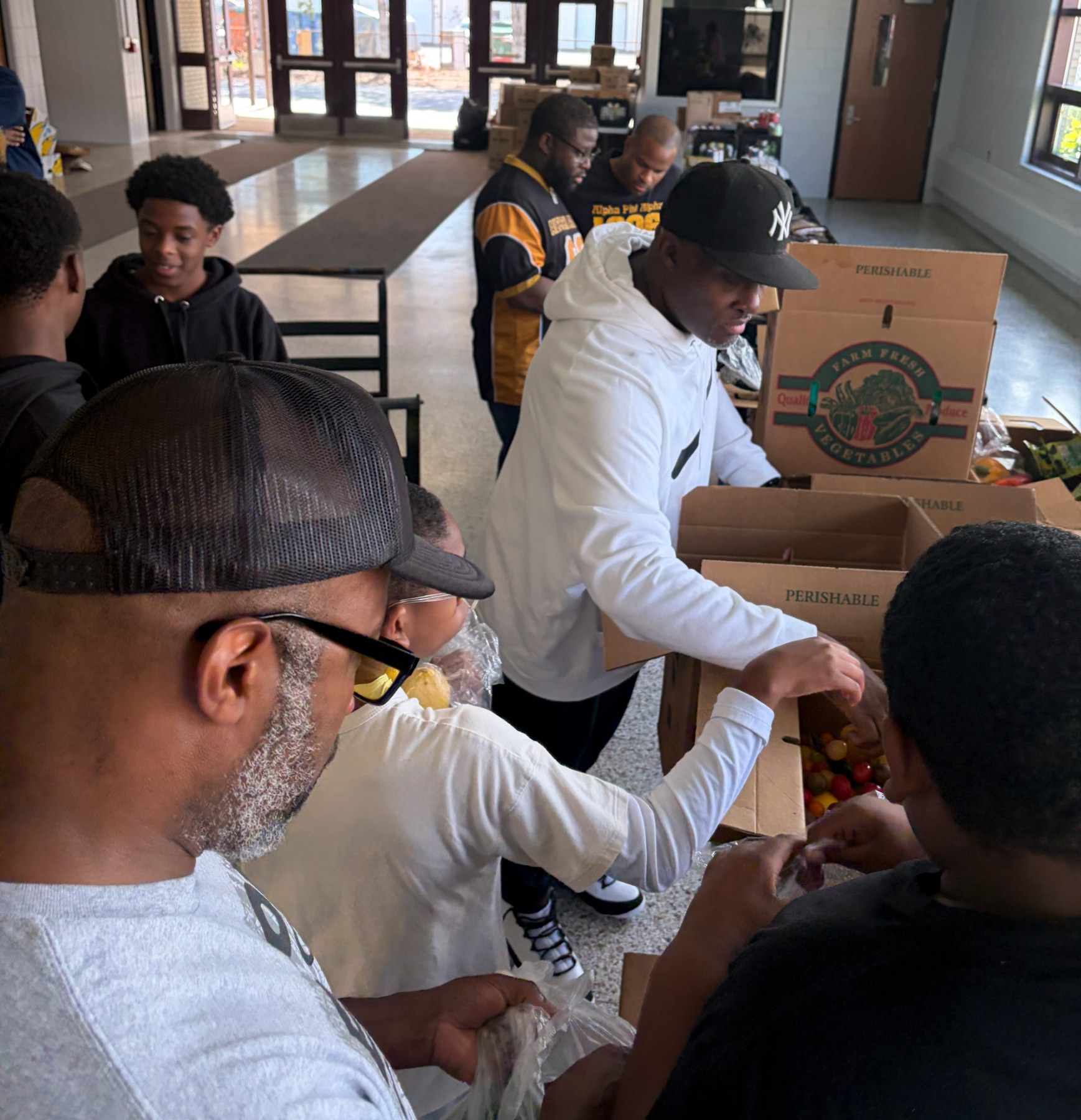 Volunteers preparing fresh food for families at the YCMS Healthy School Pantry